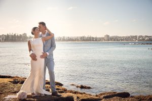 Bride and groom portrait by the water at The Boathouse Shelly Beach wedding