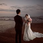 Bride reading her vows to the groom during a Long Reef beach wedding