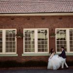 Bride and groom walking through Manly during their Northern Beaches wedding