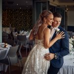 Emma and Luke inside Palm Beach Golf Club before their wedding reception
